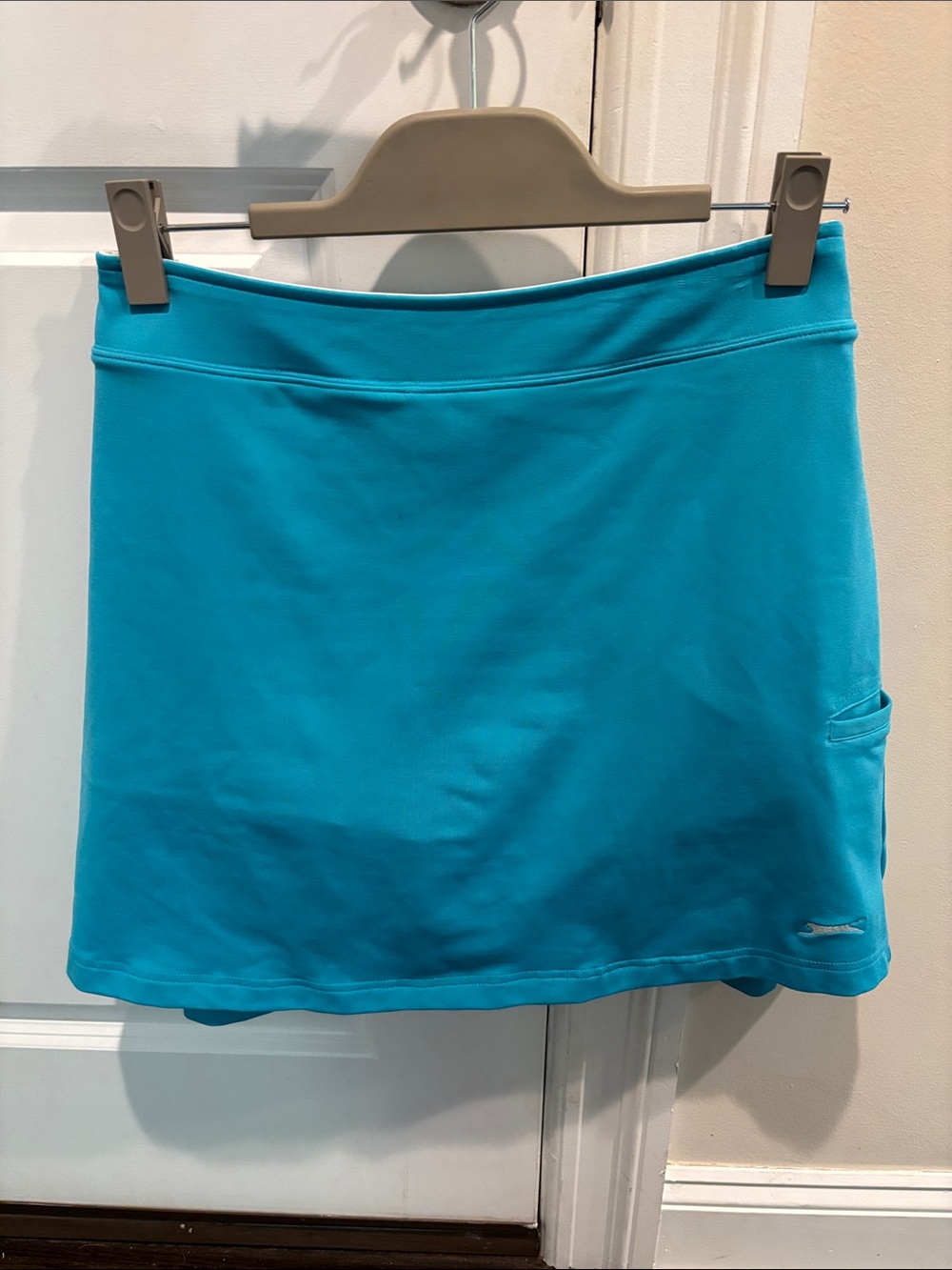 Slazenger Women's Golf Skort in Bright Teal.